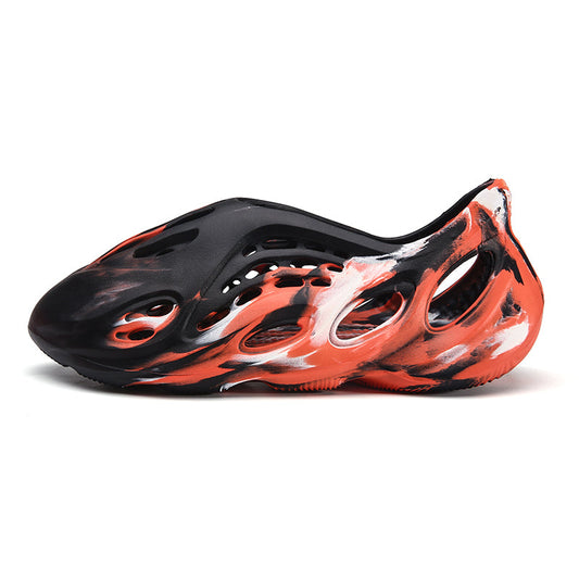 Side profile of Garuda Cloud T84 Foam Runners showing organic ventilation holes