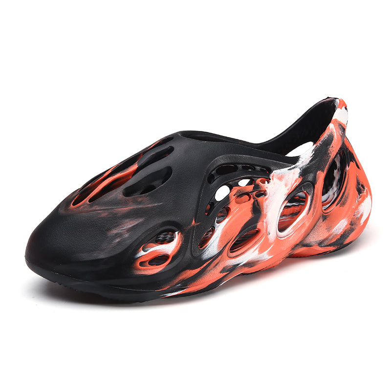 Side profile of Garuda Cloud T84 Foam Runners showing organic ventilation holes