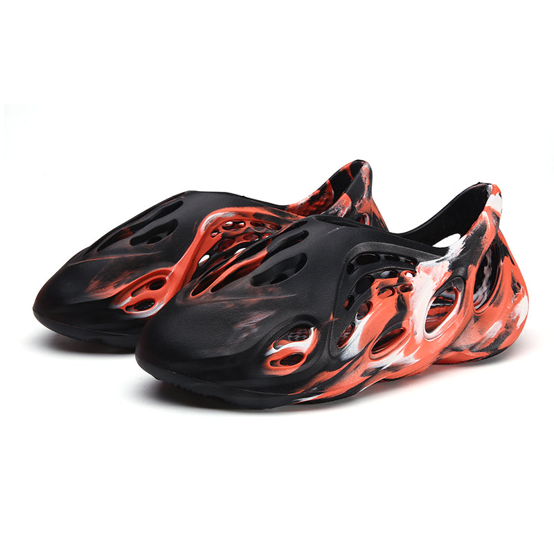 Side profile of Garuda Cloud T84 Foam Runners showing organic ventilation holes