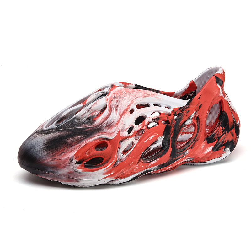 Side profile of Garuda Cloud T84 Foam Runners showing organic ventilation holes