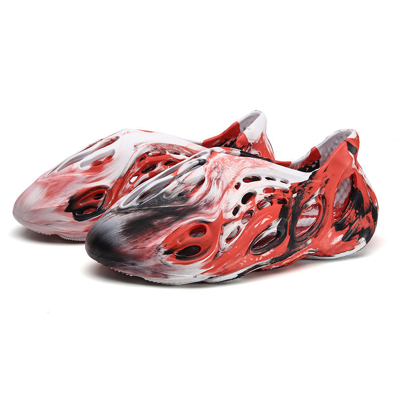 Side profile of Garuda Cloud T84 Foam Runners showing organic ventilation holes