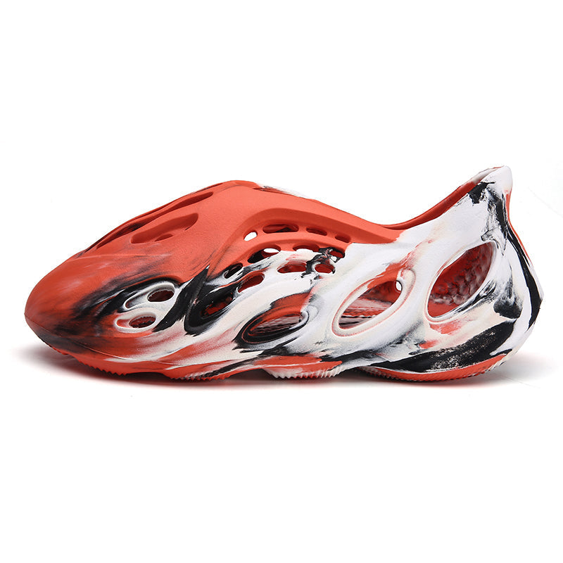 Side profile of Garuda Cloud T84 Foam Runners showing organic ventilation holes