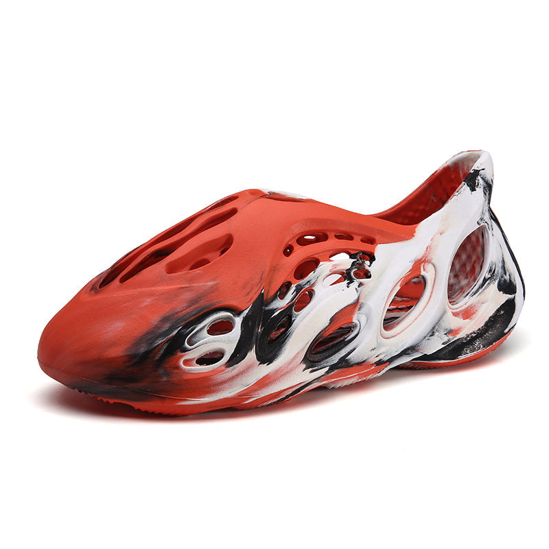 Side profile of Garuda Cloud T84 Foam Runners showing organic ventilation holes