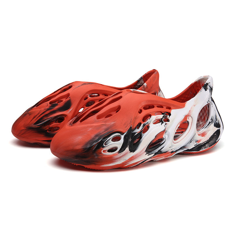 Side profile of Garuda Cloud T84 Foam Runners showing organic ventilation holes