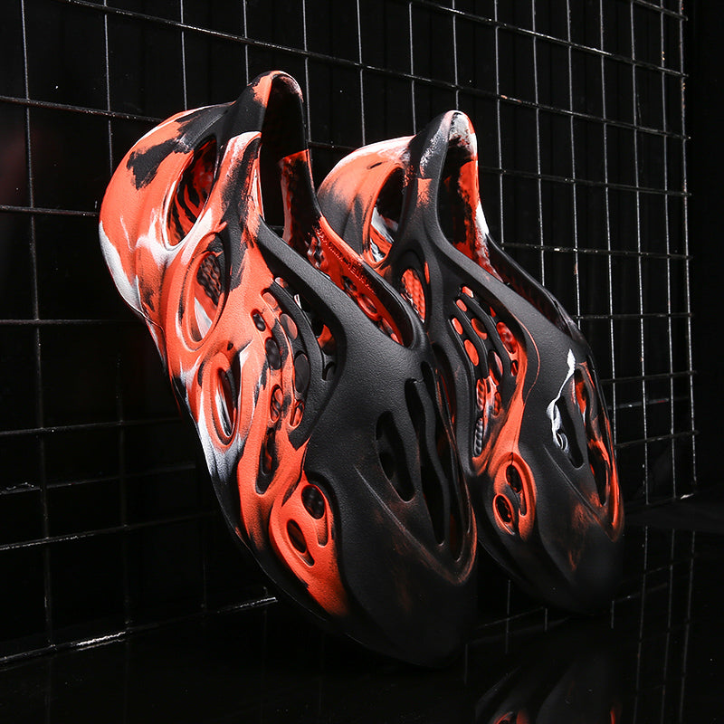 Side profile of Garuda Cloud T84 Foam Runners showing organic ventilation holes
