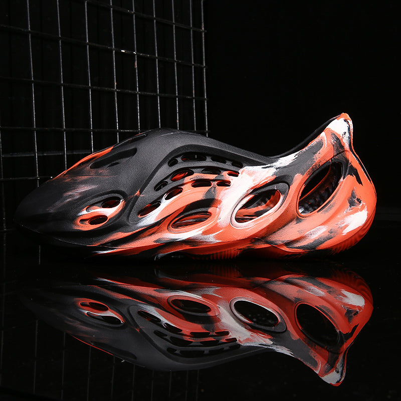 Side profile of Garuda Cloud T84 Foam Runners showing organic ventilation holes