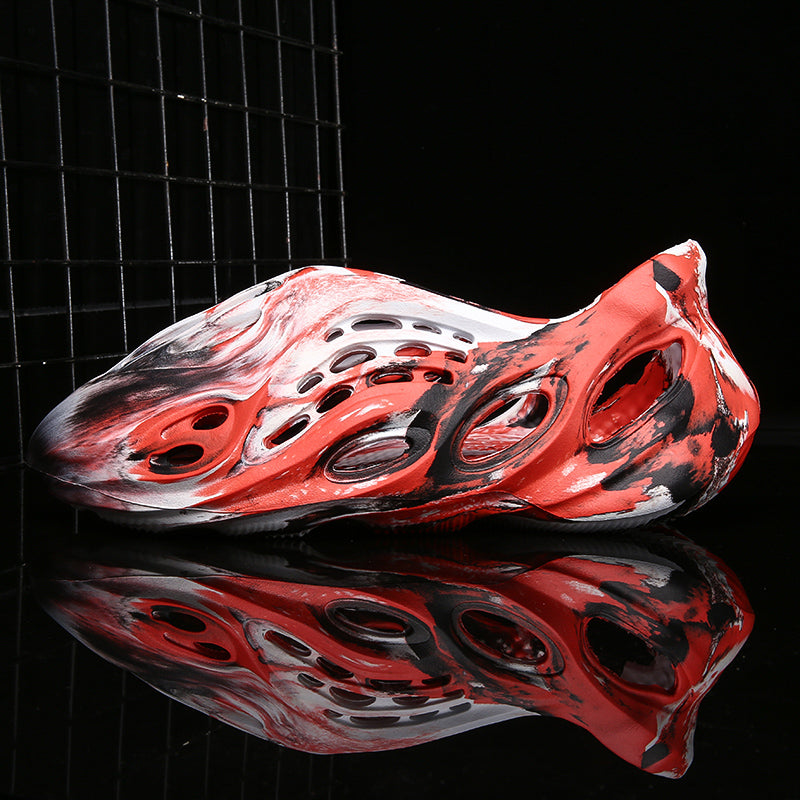 Side profile of Garuda Cloud T84 Foam Runners showing organic ventilation holes