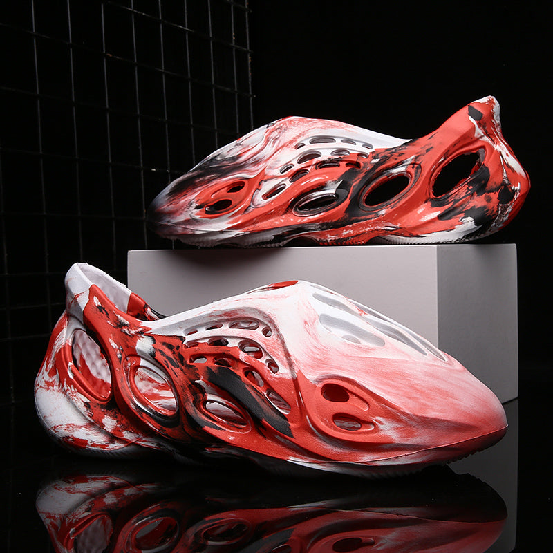 Side profile of Garuda Cloud T84 Foam Runners showing organic ventilation holes