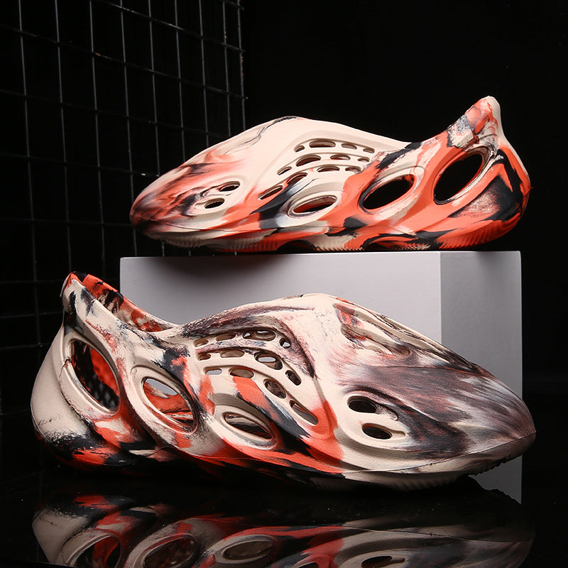 Side profile of Garuda Cloud T84 Foam Runners showing organic ventilation holes