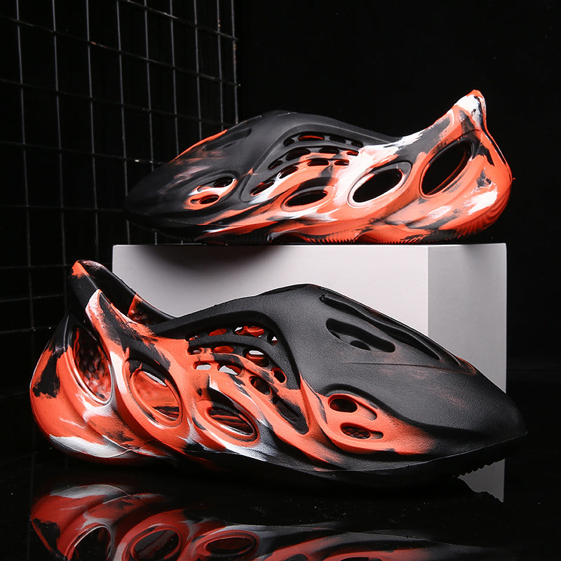 Side profile of Garuda Cloud T84 Foam Runners showing organic ventilation holes