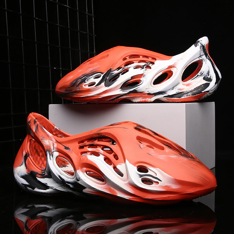Side profile of Garuda Cloud T84 Foam Runners showing organic ventilation holes