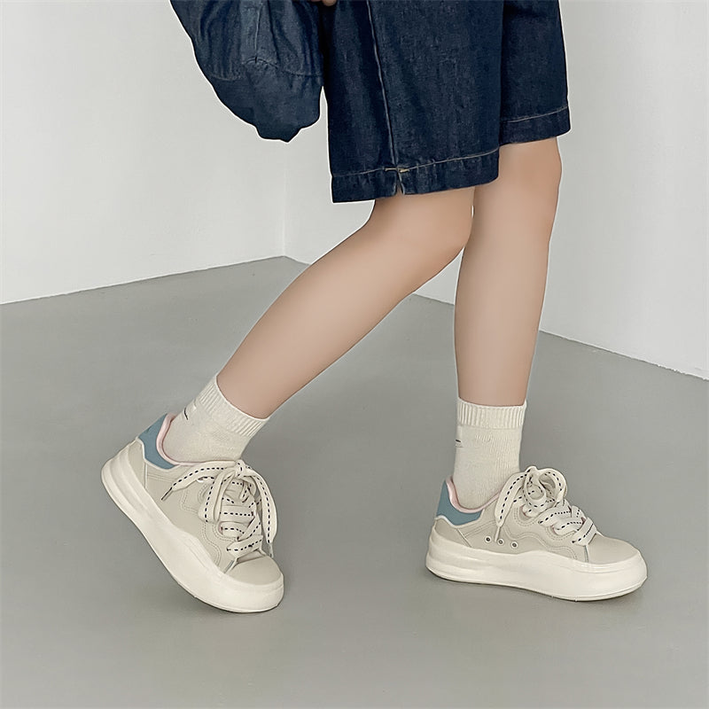 Side view of Movo Splash T84 sneakers showing the waterproof shell and oversized platform