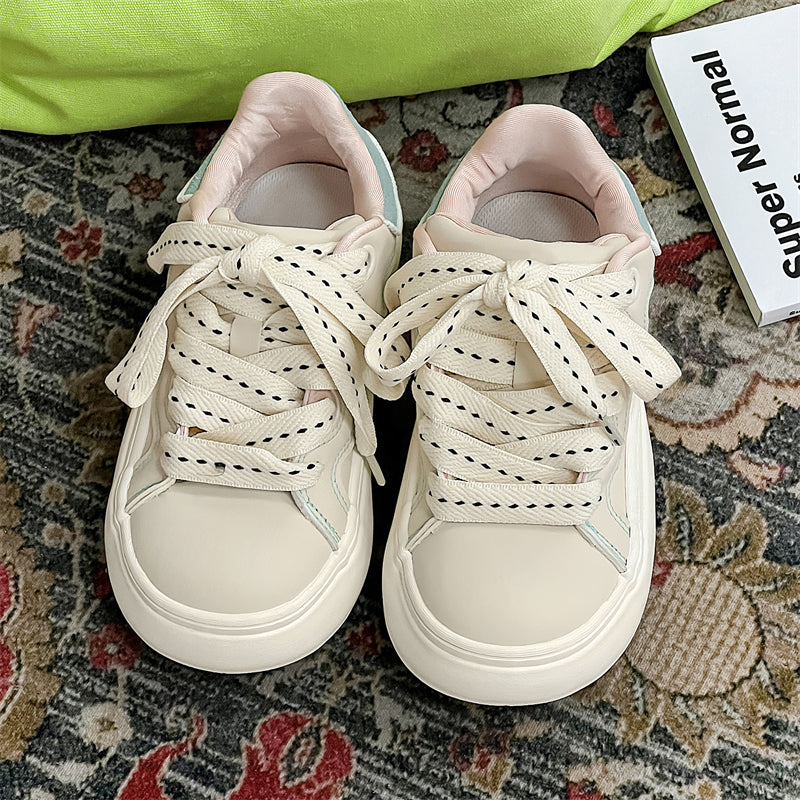 Side view of Movo Splash T84 sneakers showing the waterproof shell and oversized platform