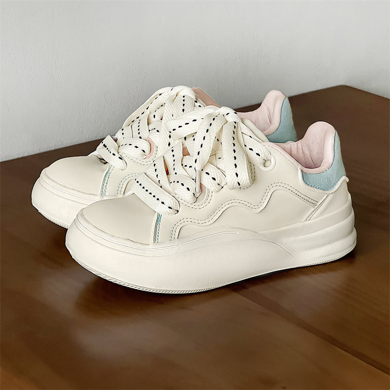 Side view of Movo Splash T84 sneakers showing the waterproof shell and oversized platform