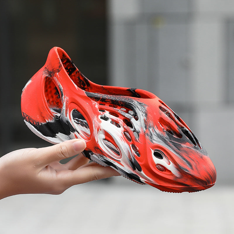 Side profile of Garuda Cloud T84 Foam Runners showing organic ventilation holes