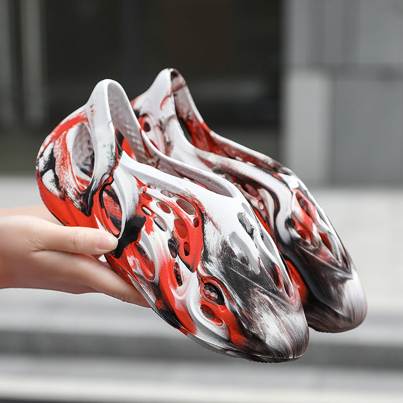 Side profile of Garuda Cloud T84 Foam Runners showing organic ventilation holes
