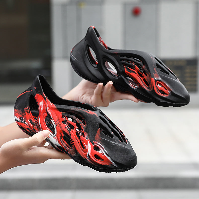 Side profile of Garuda Cloud T84 Foam Runners showing organic ventilation holes