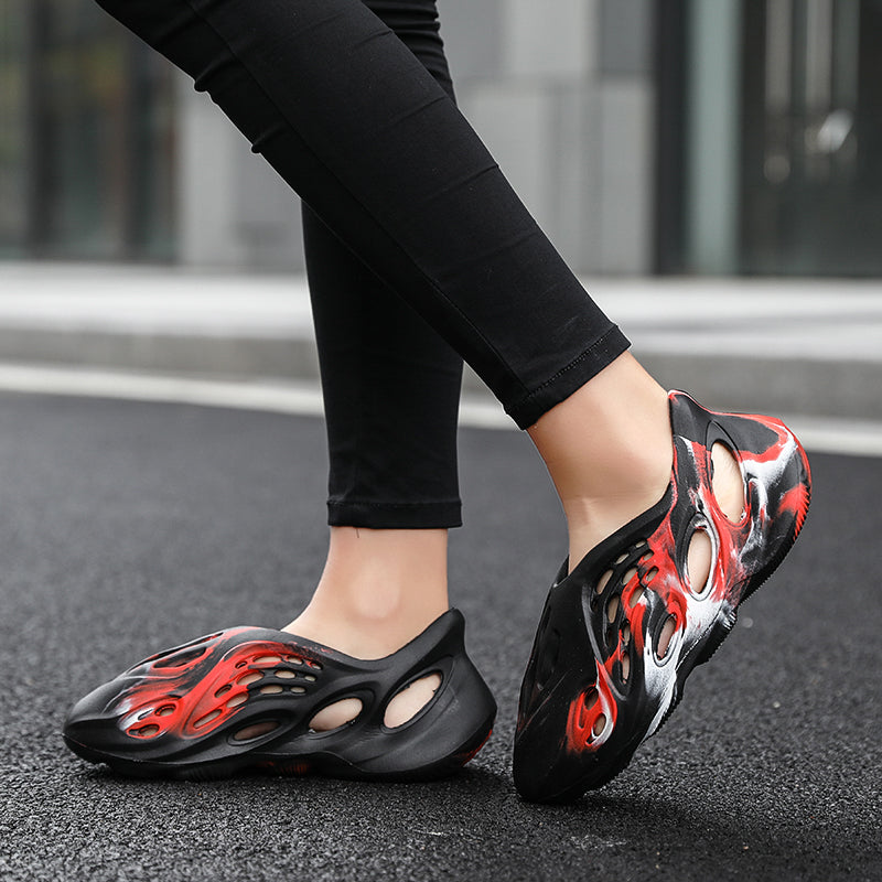 Side profile of Garuda Cloud T84 Foam Runners showing organic ventilation holes