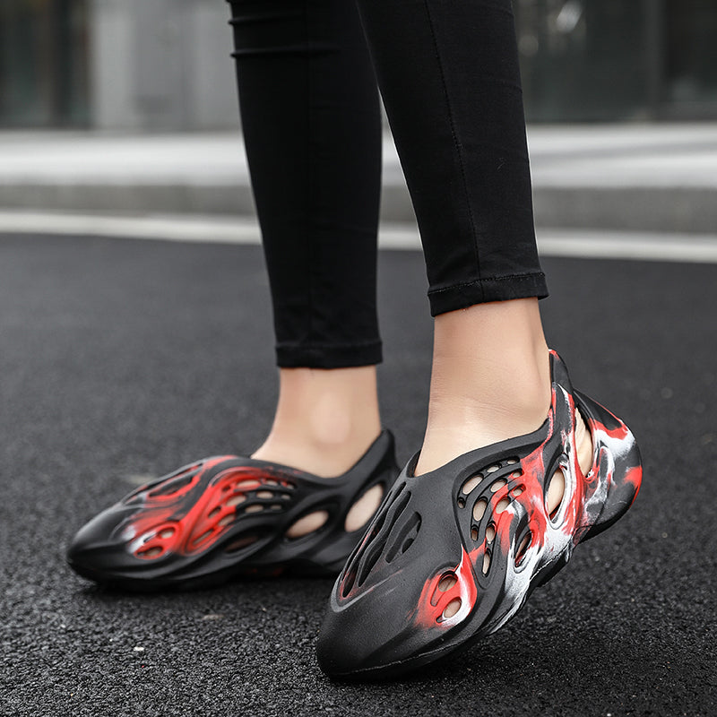 Side profile of Garuda Cloud T84 Foam Runners showing organic ventilation holes