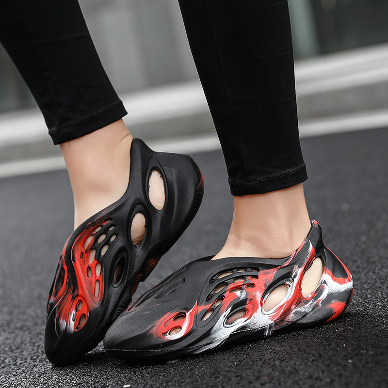 Side profile of Garuda Cloud T84 Foam Runners showing organic ventilation holes
