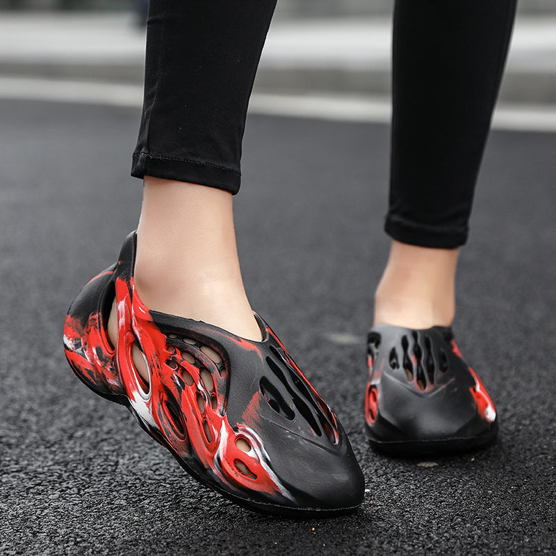 Side profile of Garuda Cloud T84 Foam Runners showing organic ventilation holes