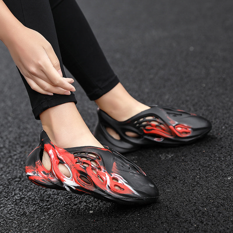 Side profile of Garuda Cloud T84 Foam Runners showing organic ventilation holes