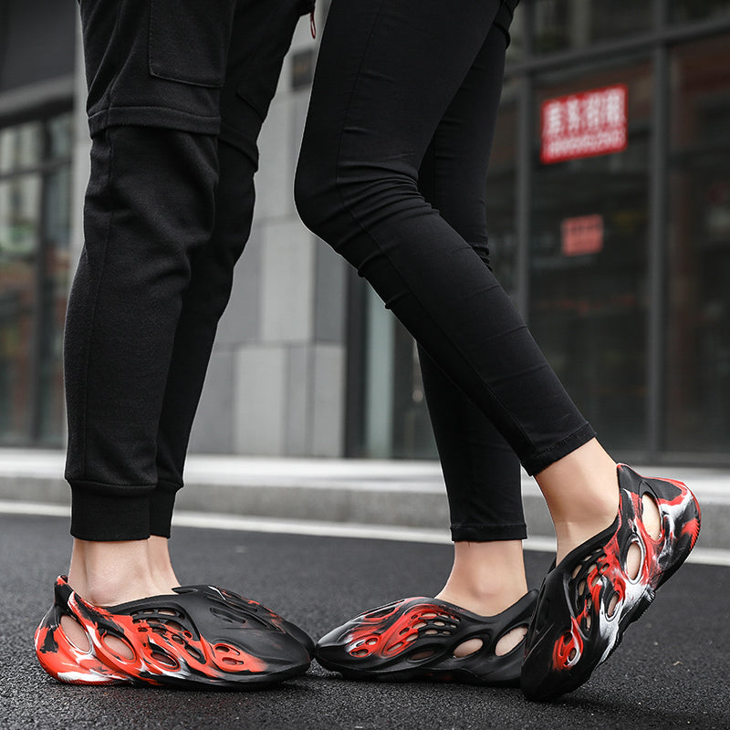 Side profile of Garuda Cloud T84 Foam Runners showing organic ventilation holes