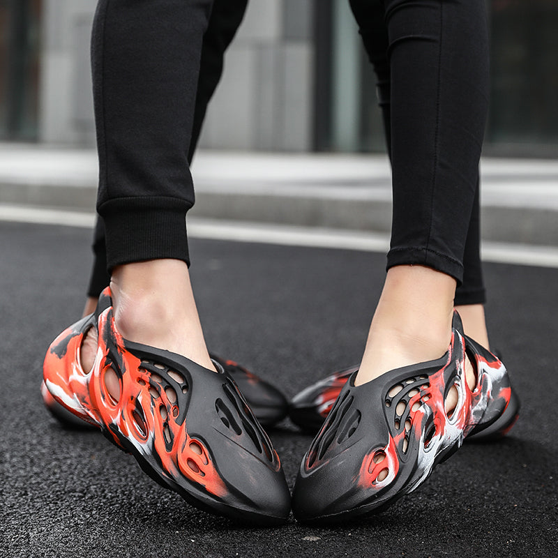 Side profile of Garuda Cloud T84 Foam Runners showing organic ventilation holes
