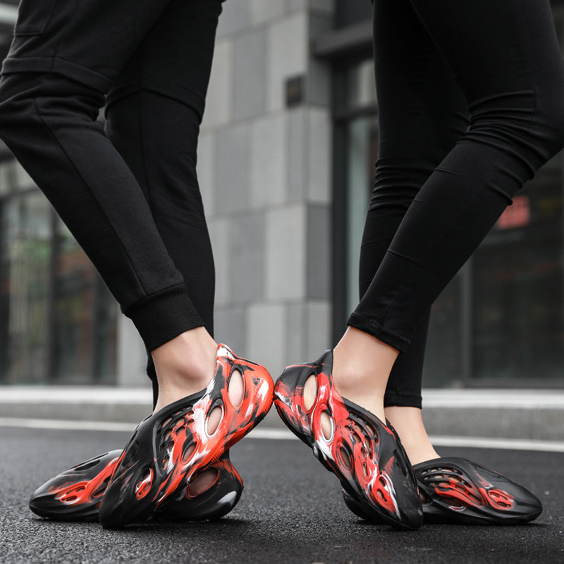 Side profile of Garuda Cloud T84 Foam Runners showing organic ventilation holes