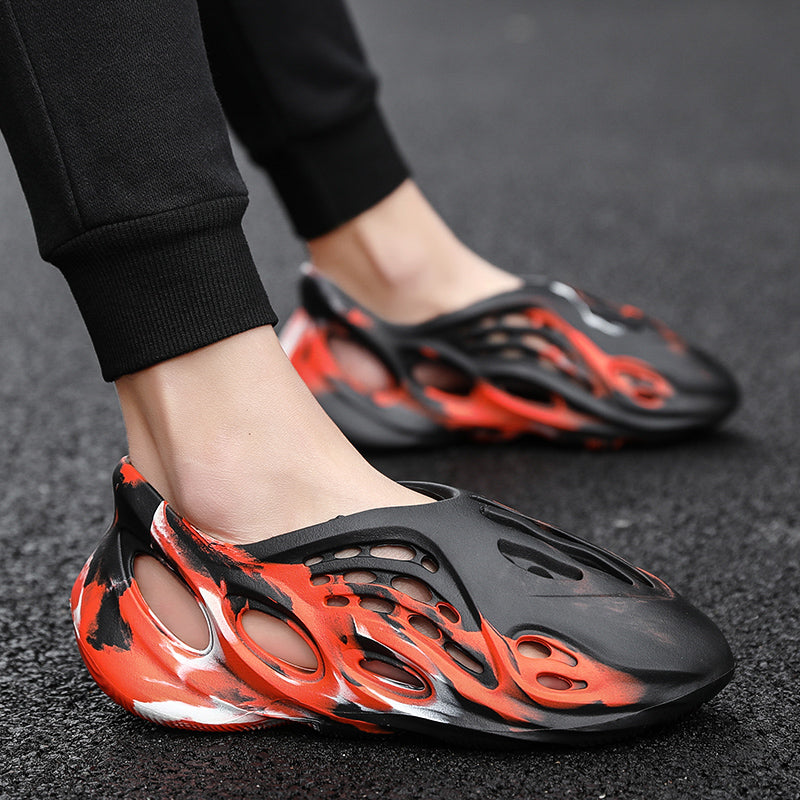 Side profile of Garuda Cloud T84 Foam Runners showing organic ventilation holes