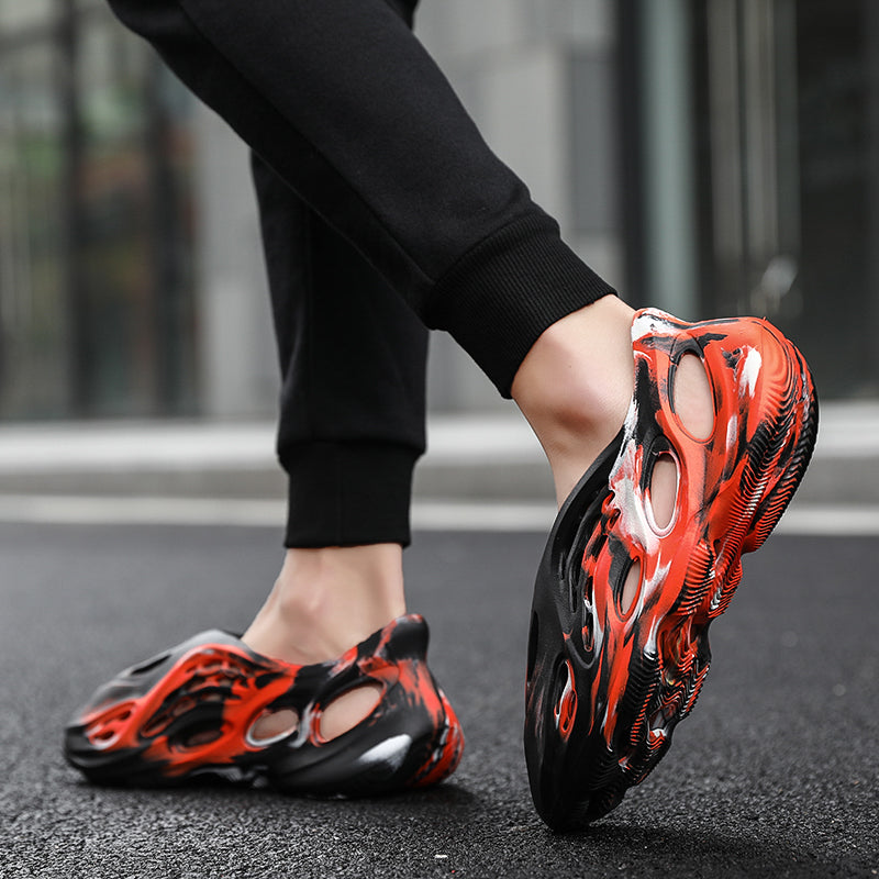 Side profile of Garuda Cloud T84 Foam Runners showing organic ventilation holes