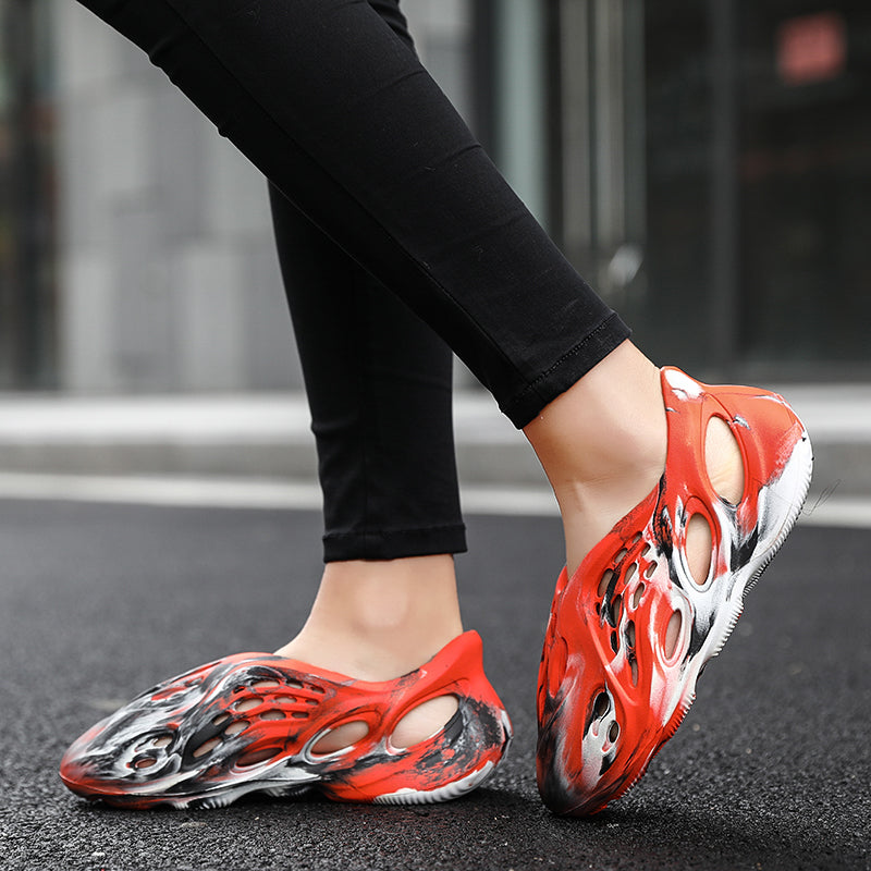Side profile of Garuda Cloud T84 Foam Runners showing organic ventilation holes