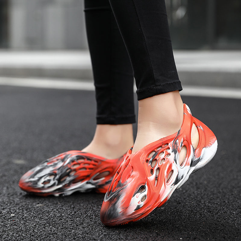Side profile of Garuda Cloud T84 Foam Runners showing organic ventilation holes