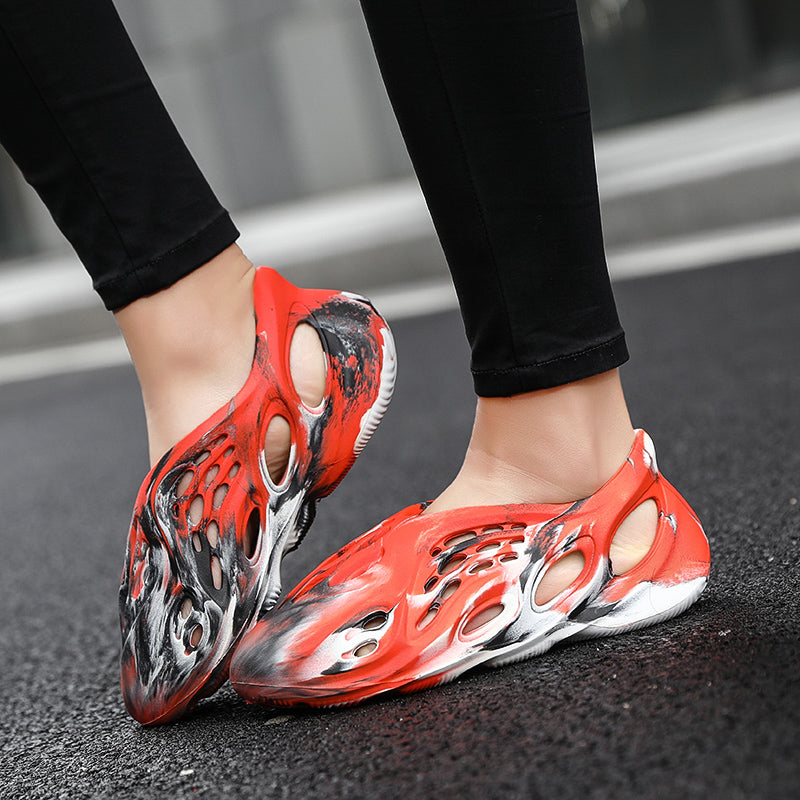 Side profile of Garuda Cloud T84 Foam Runners showing organic ventilation holes