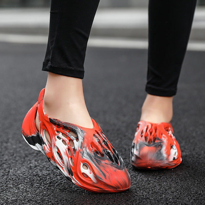 Side profile of Garuda Cloud T84 Foam Runners showing organic ventilation holes
