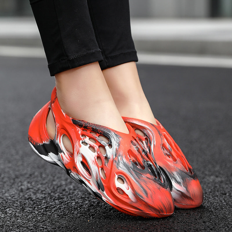 Side profile of Garuda Cloud T84 Foam Runners showing organic ventilation holes