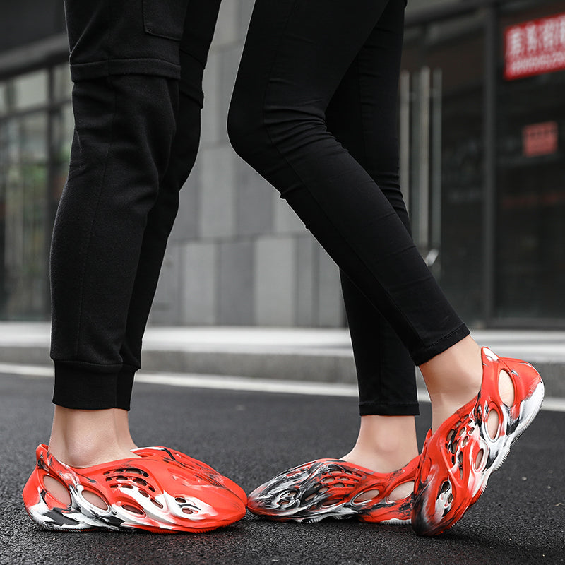 Side profile of Garuda Cloud T84 Foam Runners showing organic ventilation holes