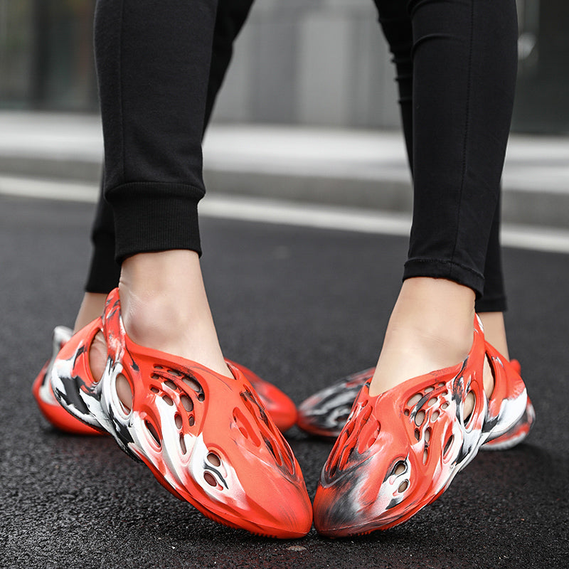 Side profile of Garuda Cloud T84 Foam Runners showing organic ventilation holes