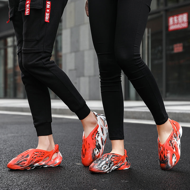 Side profile of Garuda Cloud T84 Foam Runners showing organic ventilation holes