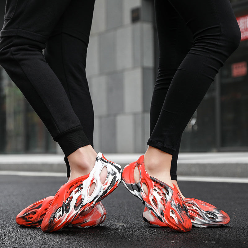 Side profile of Garuda Cloud T84 Foam Runners showing organic ventilation holes