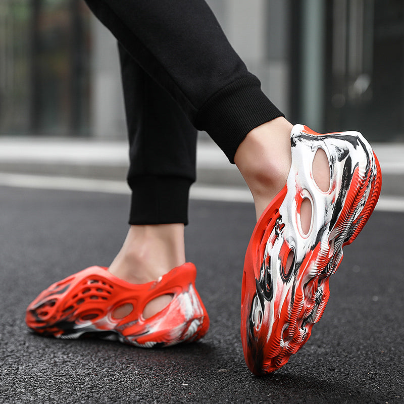 Side profile of Garuda Cloud T84 Foam Runners showing organic ventilation holes