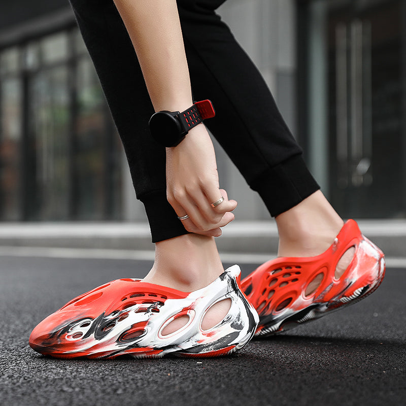 Side profile of Garuda Cloud T84 Foam Runners showing organic ventilation holes