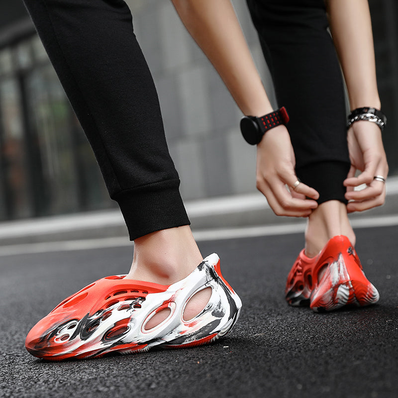 Side profile of Garuda Cloud T84 Foam Runners showing organic ventilation holes