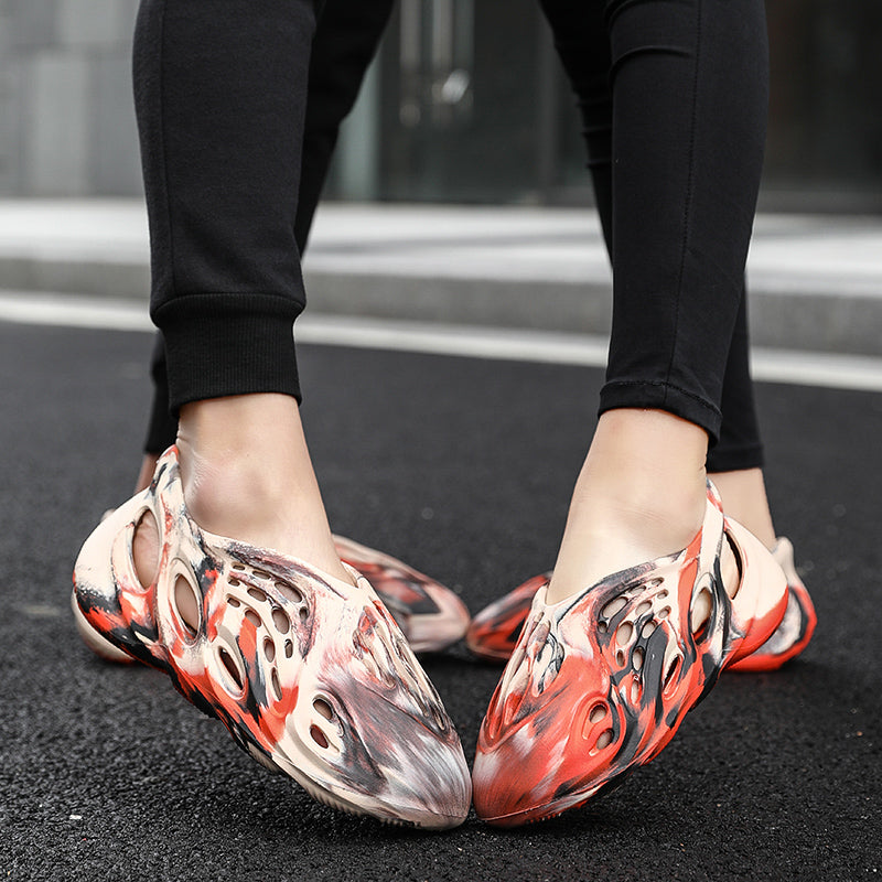 Side profile of Garuda Cloud T84 Foam Runners showing organic ventilation holes