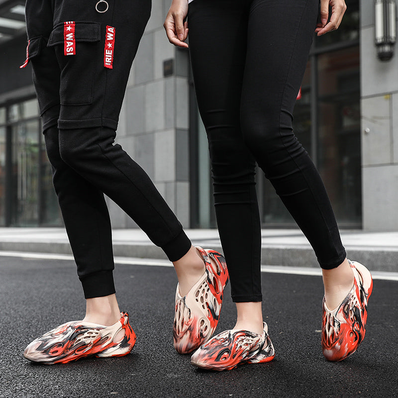 Side profile of Garuda Cloud T84 Foam Runners showing organic ventilation holes
