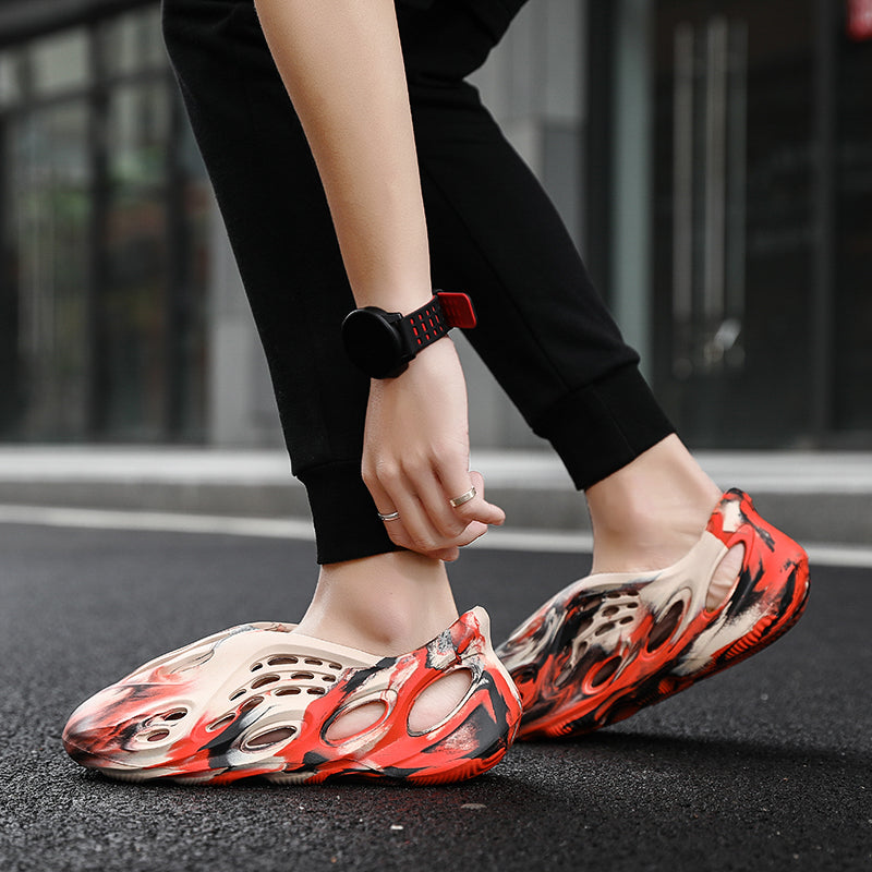 Side profile of Garuda Cloud T84 Foam Runners showing organic ventilation holes