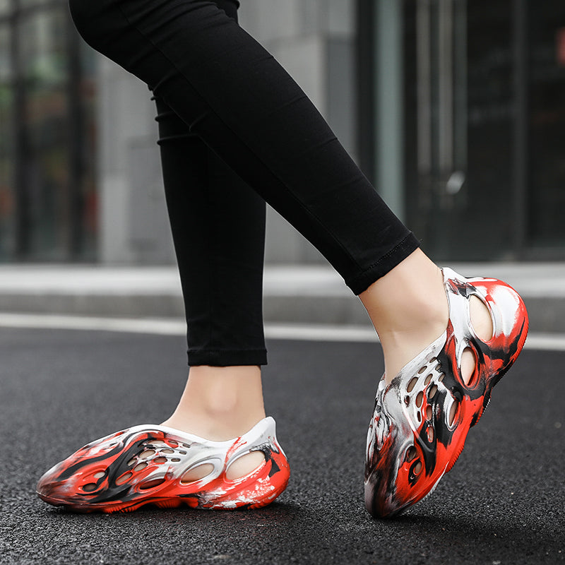 Side profile of Garuda Cloud T84 Foam Runners showing organic ventilation holes