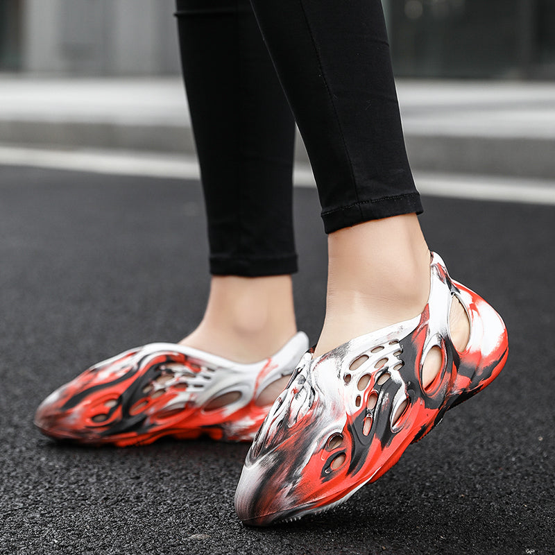 Side profile of Garuda Cloud T84 Foam Runners showing organic ventilation holes