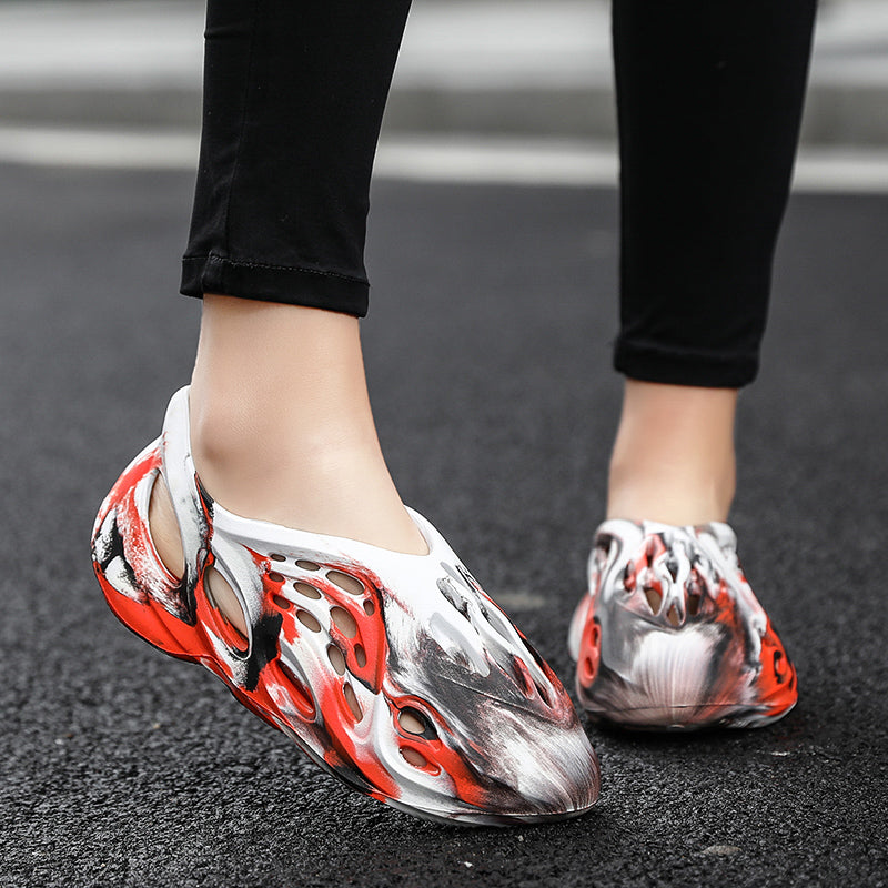 Side profile of Garuda Cloud T84 Foam Runners showing organic ventilation holes