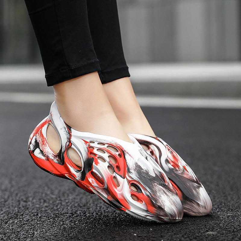 Side profile of Garuda Cloud T84 Foam Runners showing organic ventilation holes